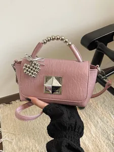 Elegant pink small square shoulder bag with silver beaded handle and heart charm