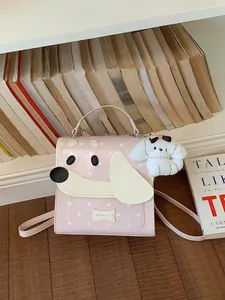 Cute pink dog-themed school backpack for girls with star pattern and plush puppy charm
