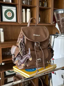 Vintage brown faux leather backpack with flap and cute dog charm for women