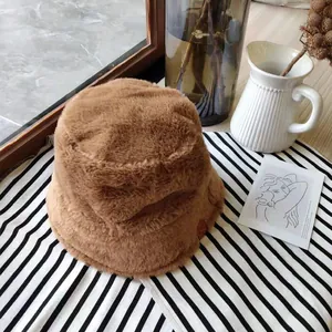 Cozy brown plush bucket hat for women presented in an aesthetic lifestyle setting