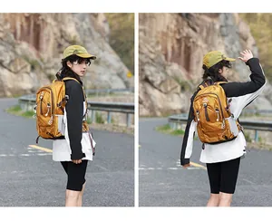 Lifestyle view of a mustard yellow hiking backpack on an outdoor mountain trail