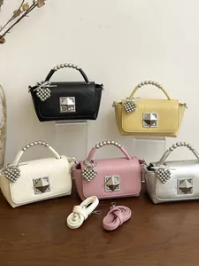 Chic small square handbags with beaded handles and heart charms in multiple colors
