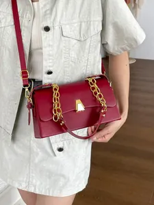 Elegant wine red rectangular shoulder bag with gold chain strap and geometric clasp