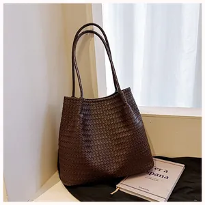Macro detail of retro dark brown woven tote bag texture in a stylish interior setting