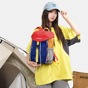 A detailed view of a multi-colored casual backpack showcased in a camping scene