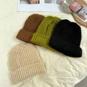 Collection of cozy chunky knit beanies for women in brown, green, black and beige