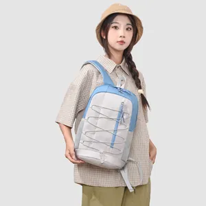 Outdoor sports backpack shown on an Asian model with minimalist casual design.