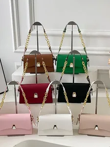 Collection of elegant small square bags in various colors with gold chain straps