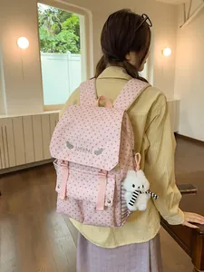 Stylish pink backpack with grey star pattern and cute plush bunny charm for women
