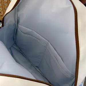 Close-up detail of the spacious interior lining with dual open pockets for organized storage