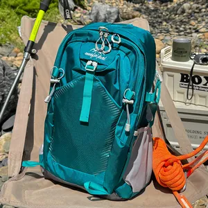 Close-up detail of the lightweight waterproof fabric on a teal hiking backpack