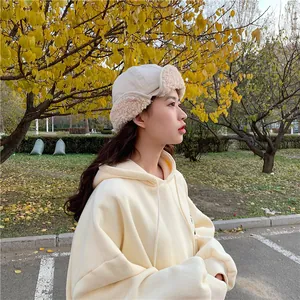 Warm winter earflap hat for women with plush lining in a cute Japanese style profile view.