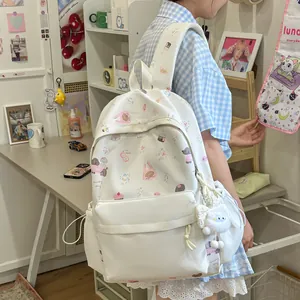 Side view of white kawaii backpack with cute animal patterns worn by student in room