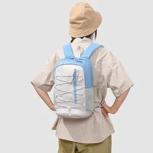 Rear view of a minimalist blue and white outdoor sports backpack on a student model