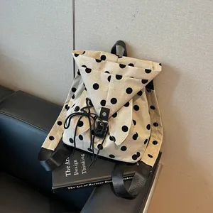 Stylish beige linen polka dot backpack for women with drawstring and buckle closure detail