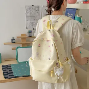 Sweet yellow backpack for students with cute bear and cake prints