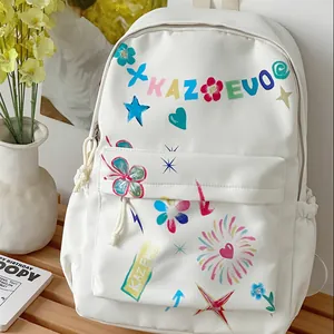 Close-up of white backpack with colorful graffiti prints and KAZEVO text