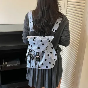 Stylish grey polka dot backpack for women, perfect for students and casual daily commuting.