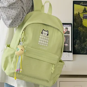 Light green minimalist student backpack with cute cat embroidery and moon pendant