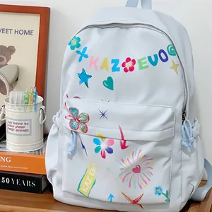 Detail view of light blue women's backpack with vibrant colorful graffiti floral patterns.