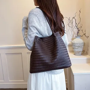 Detailed macro view showing the textured woven pattern of this dark brown retro tote bag.