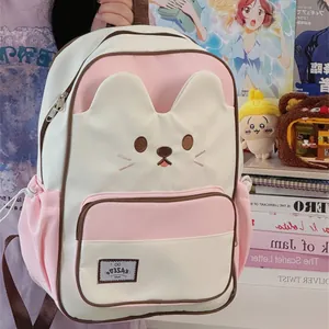 Close-up of cute cat-faced pink and white backpack for girls