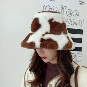 Stylish vintage cow pattern plush bucket hat for warm winter wear for women.