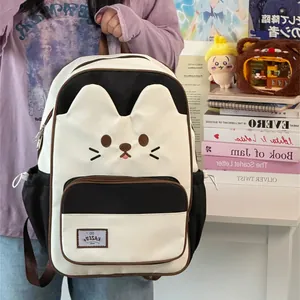 Cute black and white cat face backpack for teenage girls with large capacity school bag