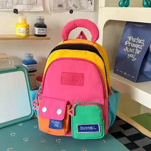 Vibrant and colorful multi-pocket backpack displayed in a stylish creative studio room.
