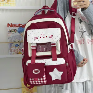 Linda mochila escolar color burdeos con orejas de gato y detalle de estrella