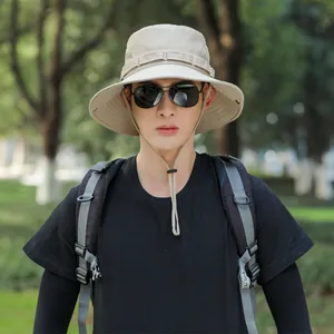 Close-up of a men's khaki outdoor sun hat with adjustable chin strap and breathable mesh.