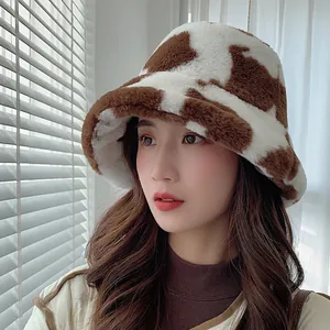 Cozy cow print plush bucket hat for women perfect for vintage winter fashion style.