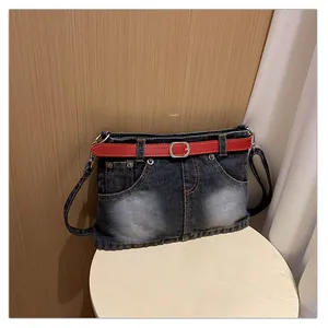 Creative denim crossbody bag featuring a unique jean-waist design with a red belt
