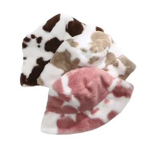 Plush cow print bucket hats in three colors for winter warmth and retro vintage style