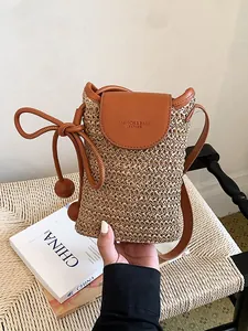 Elegant minimalist straw woven crossbody phone bag with brown leather flap for women