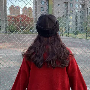 Detailed back view of a black Japanese style warm winter docker hat with ear flaps