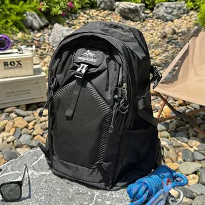 Detailed view of a professional black waterproof hiking backpack in an outdoor camping scene