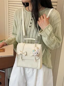 Zaino stile college bianco crema con fiocco e ciondolo a forma di coniglio