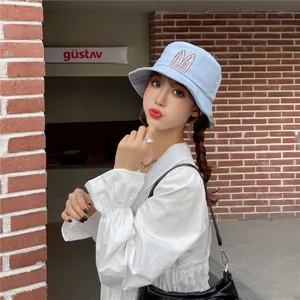 Cute light blue bucket hat with rabbit ears embroidery for a trendy casual summer look.