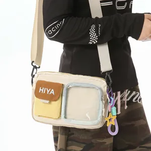 Close-up of a sporty crossbody bag with clear pocket and decorative star charm