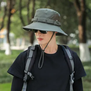 Detailed view of a green outdoor sun hat with breathable mesh and adjustable chin strap