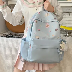 Cute light blue school backpack with puppy patterns and plush bunny keychain charm