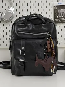 Large black PU leather commuter backpack with decorative dachshund charm and flap pocket