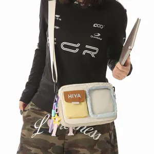 Close-up of casual outdoor crossbody bag with functional pockets and embroidered HIYA logo
