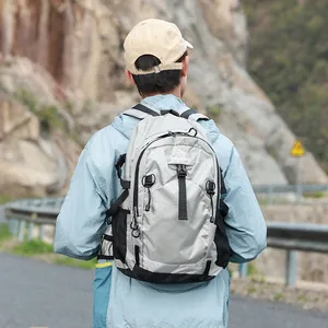 Close-up of a grey waterproof hiking backpack on an outdoor trail for travel