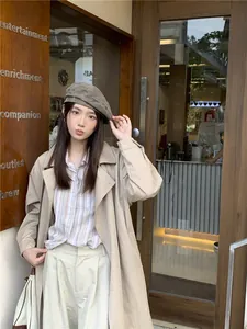 Asian model wearing a vintage washed grey denim beret in a stylish outdoor street style pose