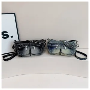 Detailed front view of vintage washed denim crossbody bags available in black and blue