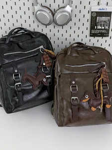 Stylish large capacity leather laptop backpack for travel and school with cute dog charms