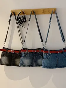 Niche denim skirt style shoulder bags with red belt accents in three vintage washes