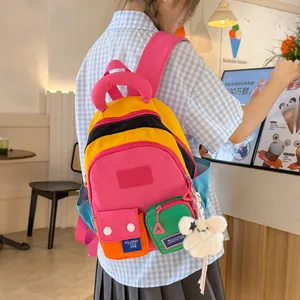 Vibrant multi-color patchwork backpack for students shown in a cozy cafe setting